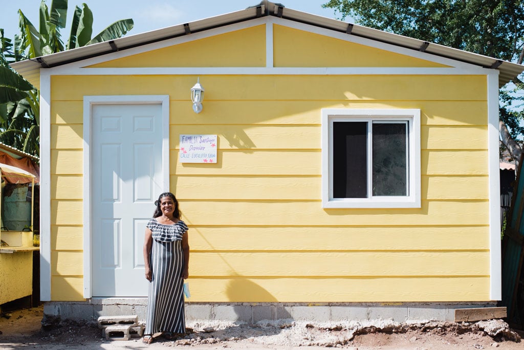 Homes-of-Hope-recipient-standing-in-front-of-her-new-house-in-Mazatlan